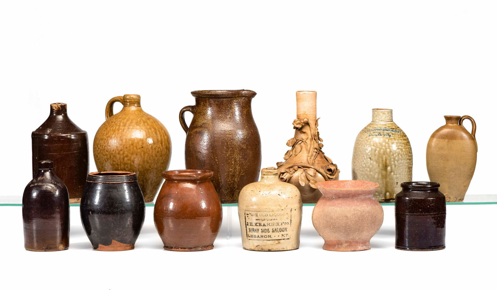 Twelve Stoneware, Redware and Earthenware Jugs, (1 of 5)
