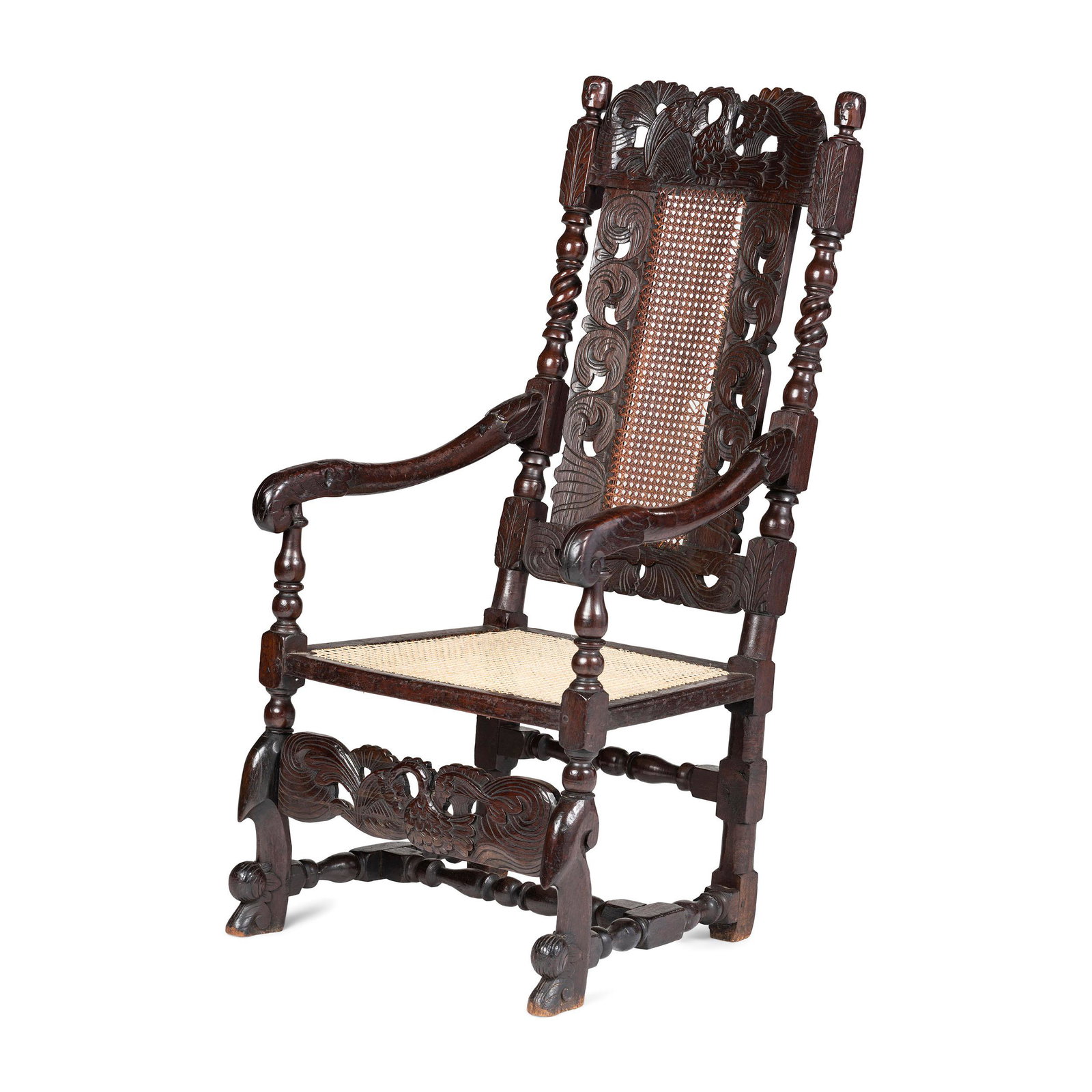 A William and Mary Swan-and-Leaf Carved and Cane: A William and Mary Swan-and-Leaf Carved and Cane Upholstered Oak Armchair English, Circa 1700 Height 47 1/2 inches. Property from the Estate of Paul Thomas Griffith, Dayton, Ohio