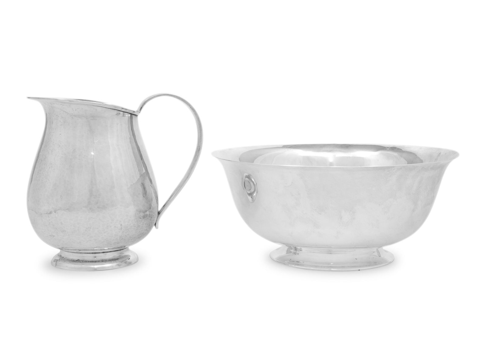 A Porter Blanchard Silver Pitcher and Basin: A Porter Blanchard Silver Pitcher and Basin Burbank, CA, Mid 20th Century each marked 'Sterling' and '1101' on underside 35 ozt 4 dwt Height of pitcher 6 1/8 inches. Property from the Estate of Patric