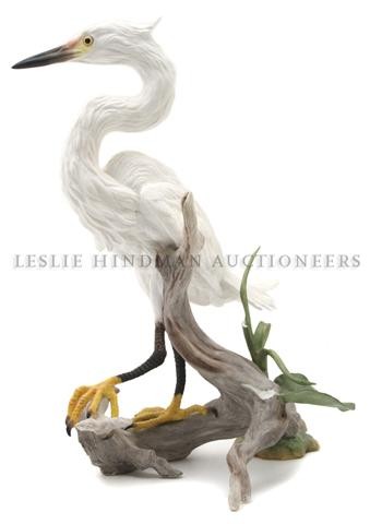 A Boehm Model of an Egret, Height 15 1/4 inches.: A Boehm Model of an Egret, modeled standing on a piece of driftwood. Height 15 1/4 inches. Property from the Estate of Anne Scholl, Indian Wells, California