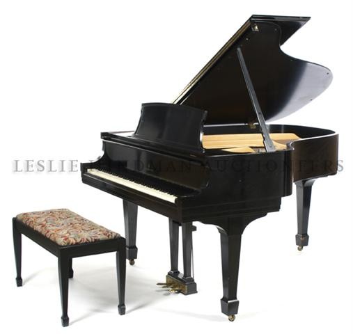 A Steinway and Sons Baby Grand Piano, Width of keyboard: A Steinway and Sons Baby Grand Piano, 1962, serial number 375127, in a black lacquer case with bench. Width of keyboard 48 inches. Property from the Estate of Dr. Warren G. Smirl, Waukesha, Wisconsin
