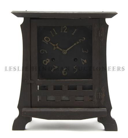 An American Oak Arts and Crafts Clock, New Haven, Heigh: An American Oak Arts and Crafts Clock, New Haven, the rectangular case centered with a dial having Arabic numerals. Height 13 1/2 inches. Property from the Museum of Science and Industry, Chicago, Ill