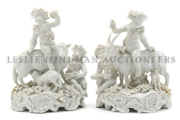 A Pair of Capodimonte Figures, Height 8 inches.: A Pair of Capodimonte Figures, each depicting putti, one with goats and the other with sheep set on a Rococo base. Height 8 inches. Property from the Collection of Greg Peterson, Kettering, Ohio