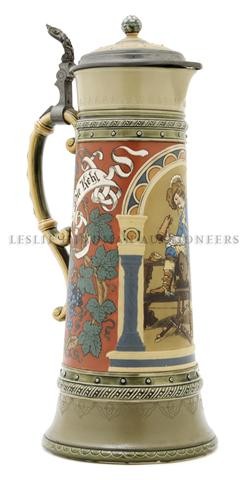 A Mettlach Stein, Height 16 1/4 inches.: A Mettlach Stein, model 2430, of tapering cylindrical form, decorated with a cavalier drinking from a stein with a crossbow at his feet. Height 16 1/4 inches.