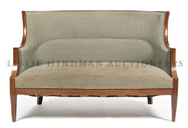 An Empire Mahogany Settee, Width 50 inches.: An Empire Mahogany Settee, having upholstered back, arms and seat within banded frame, raised on squared, tapering legs. Width 50 inches.