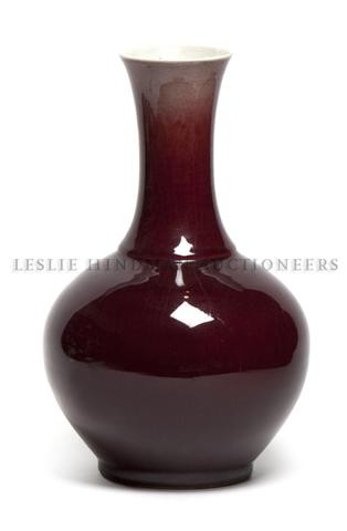 A Chinese Sang de Boeuf Porcelain Vase, Height 15 : A Chinese Sang de Boeuf Porcelain Vase, of bottle form. Height 15 1/2 inches. Property from the Estate of Marjorie Jeanne Wiley, Evanston, Illinois