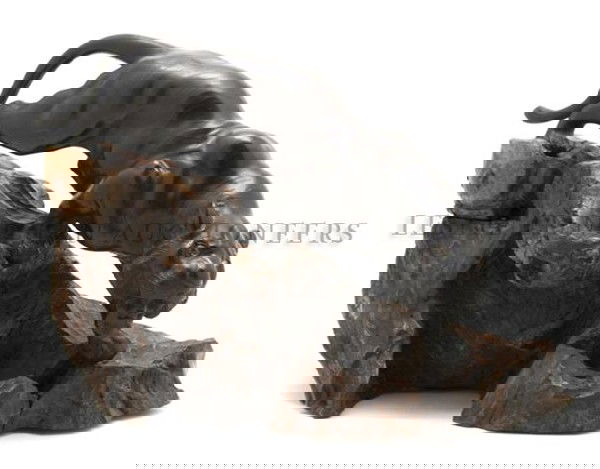 A Japanese Bronze Tiger, Width overall 20 1/4 inch: A Japanese Bronze Tiger, Meiji Period, depicted in a striding pose, having two character signature on underside, raised upon a naturalistic rock form base. Width overall 20 1/4 inches.