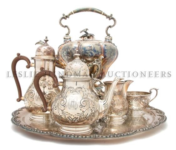 An English Assembled Silverplate Tea and Coffee Se: An English Assembled Silverplate Tea and Coffee Service, comprising a matching teapot, coffee pot, creamer and sugar, together with an associated hot water kettle on stand and tray. Height of tallest 