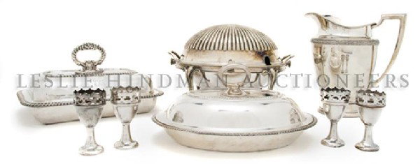 A Collection of Silverplate Serving Articles, Heig: A Collection of Silverplate Serving Articles, comprising two lidded serving dishes, a bacon warmer, a water pitcher and four egg cups; eight items total. Height of tallest 8 1/2 inches. Property from 