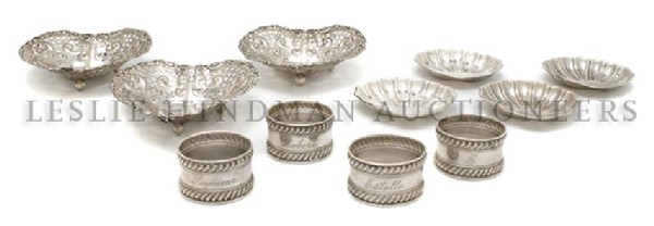 Three American Sterling Silver Nut Dishes, Gorham,: Three American Sterling Silver Nut Dishes, Gorham, of heart form with pierced decoration, raised on three ball feet, together with four shell form dishes and four Gorham napkin rings; 11 items total, 