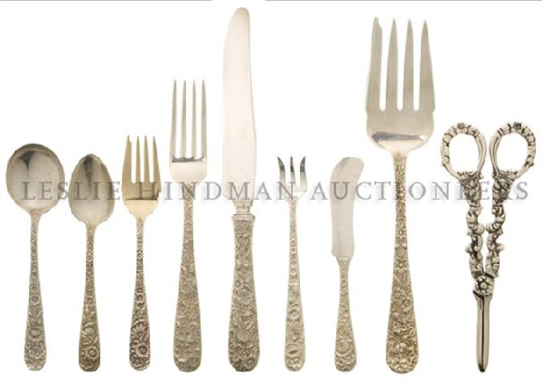 An American Sterling Silver Flatware Service, S. K: An American Sterling Silver Flatware Service, S. Kirk & Son, in the Repousse pattern, comprising 12 soup spoons, 23 teaspoons, a three piece carving set, 12 salad forks, 12 dinner forks, 12 cocktail f