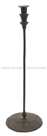A Tiffany Studios Bronze Candlestick, Height 17 1: A Tiffany Studios Bronze Candlestick, of slender form, stamped with Tiffany Decorating mark, New York, 26522. Height 17 1/2 inches.