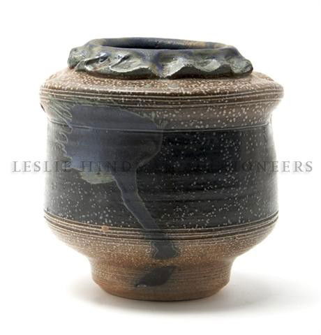 A Stoneware Vase, Don Reitz (b. 1929), Height 6 1: A Stoneware Vase, Don Reitz (b. 1929), having pinched rim above bands of brown and black glaze with white speckle decoration throughout and a splash of green glaze to center band, inscribed Reitz on b