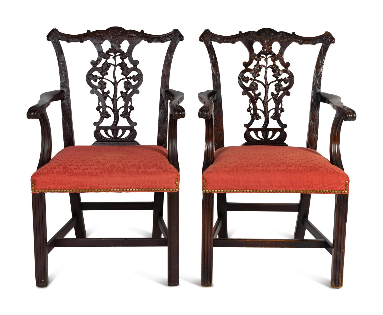 A Pair of George III Style Carved Mahogany Armchairs: A Pair of George III Style Carved Mahogany Armchairs 19th Century together with associated cushions. Height of each 37 1/2 x width 23 1/2 x depth 22 1/2 inches. Property from the Estate of Emily Bourn