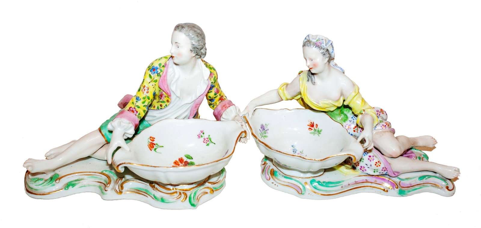 A Pair of Meissen Porcelain Sweetmeat Stands Height 4: A Pair of Meissen Porcelain Sweetmeat Stands 19th Century modeled as a reclining maiden and gentleman before a bowl, raised on a rocaille base; crossed swords mark in underglaze blue, impressed numera