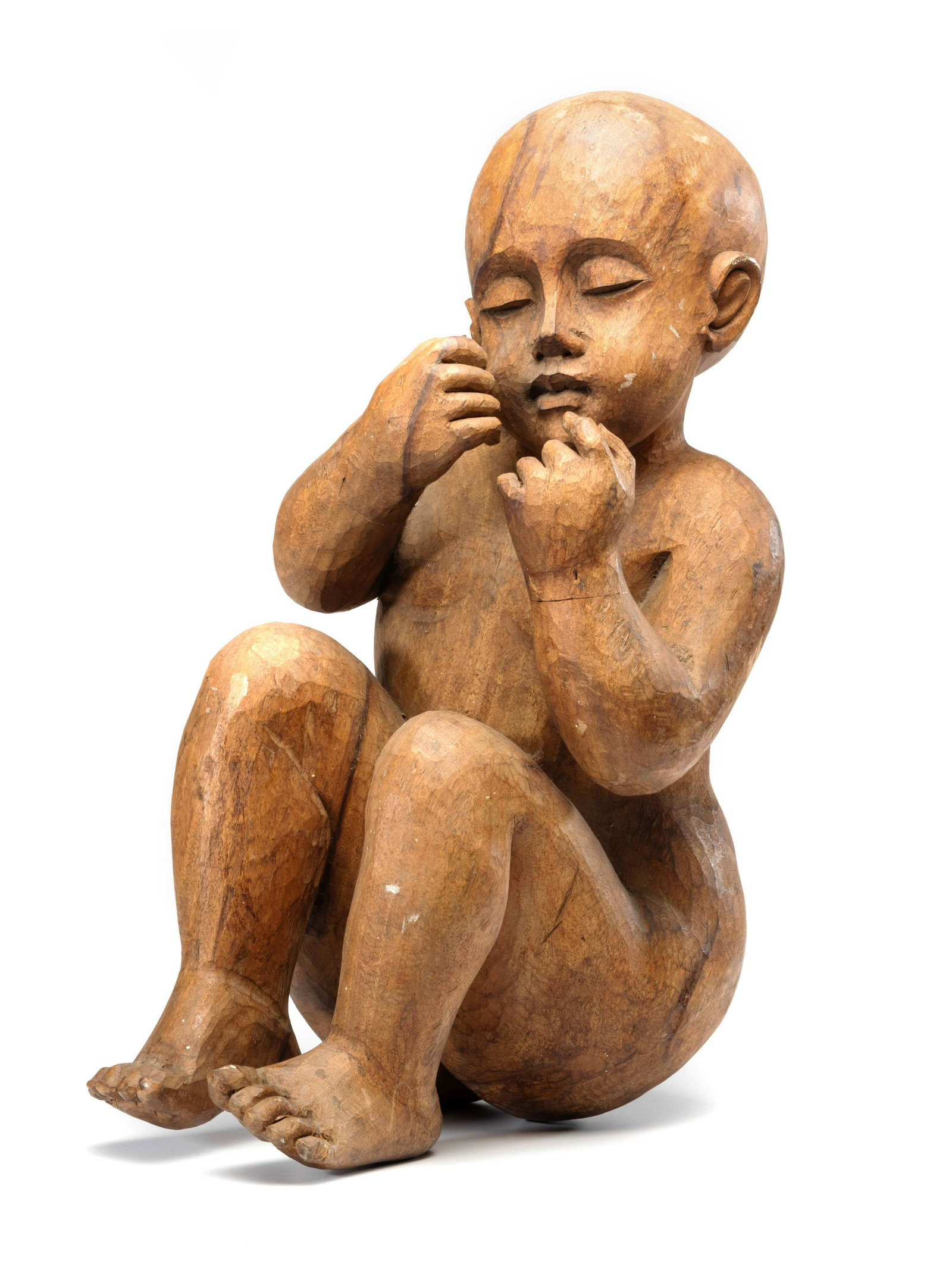 A Carved Wooden Sculpture of a Sleeping Baby: A Carved Wooden Sculpture of a Sleeping Baby 20th Century Height 24 inches. Property from the Collection of Dr. James Dawson, Manchester, Kentucky