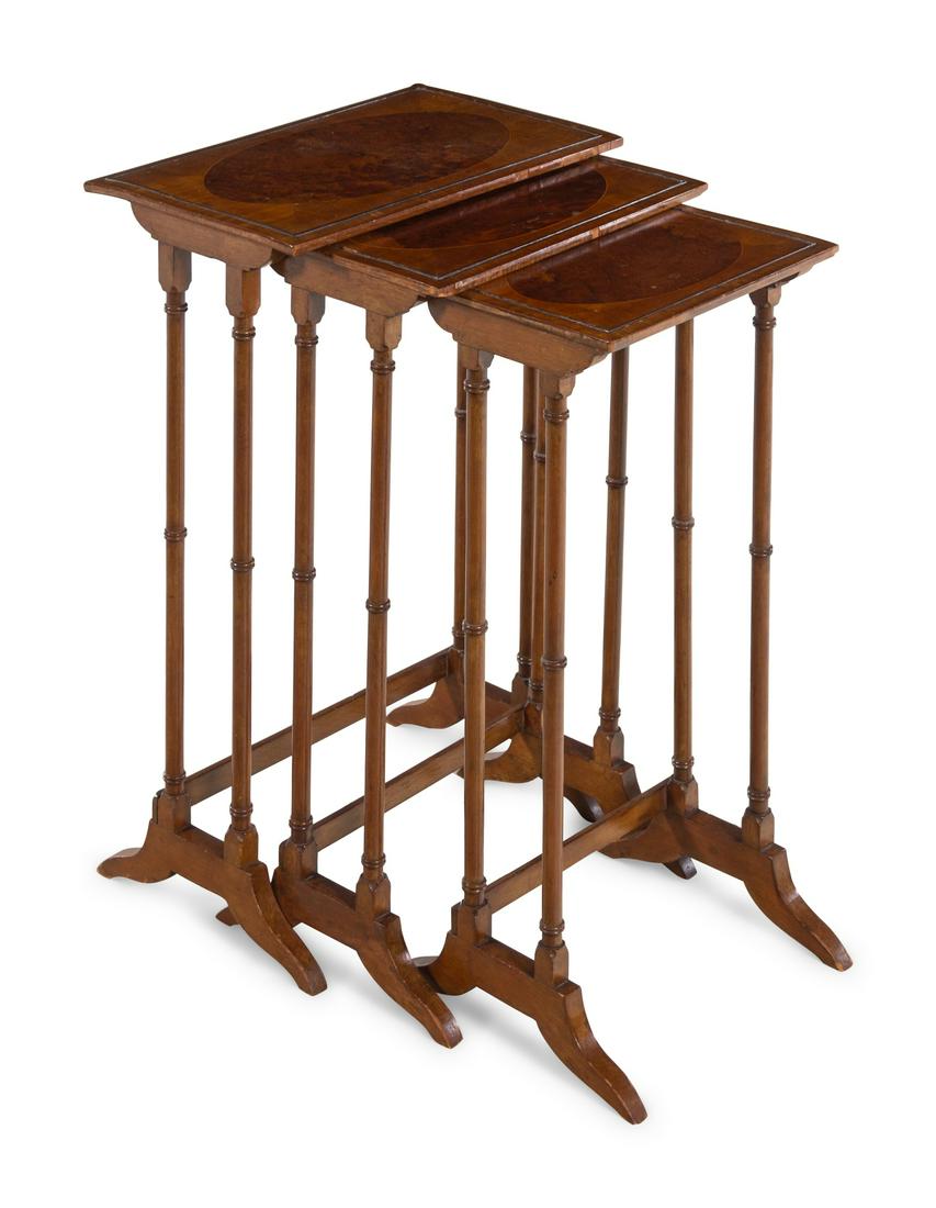 A Set of Three George III Style Satinwood and Yew Wood: A Set of Three George III Style Satinwood and Yew Wood Nesting Tables 19th Century Height of tallest 27 1/4 x width 17 5/8 x depth 10 7/8 inches.