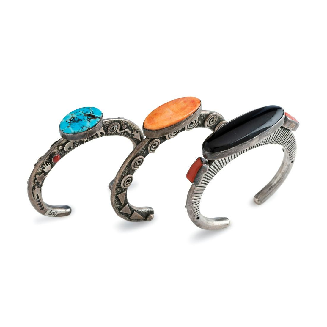 Alex Sanchez (Dine, b. 1969) Group of Sterling Silver: Alex Sanchez (Dine, b. 1969) Group of Sterling Silver Cuff Bracelets, with Inlay lot of 3, all signed Alex Sanchez and marked Sterling, includes: a cast silver cuff, set with a single turquoise caboch