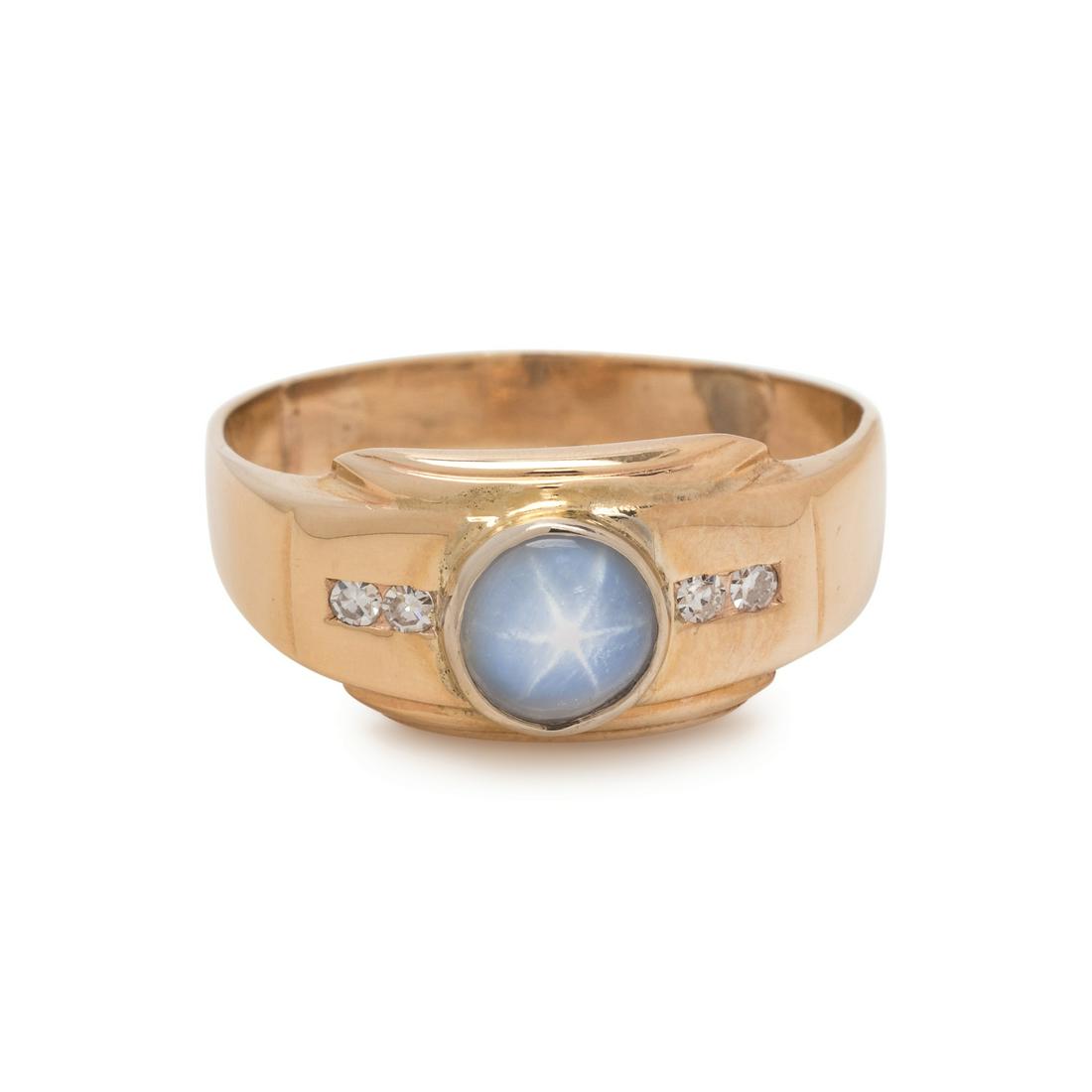 STAR SAPPHIRE AND DIAMOND RING: STAR SAPPHIRE AND DIAMOND RING Containing one round cabochon star sapphire measuring approximately 5.75 mm in diameter and four single cut diamonds. Mounted in rose gold. Ring size 9. Stamp: 14K. 2.40