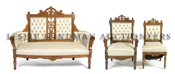 A Victorian Walnut Three Piece Parlor Suite, Width of f: A Victorian Walnut Three Piece Parlor Suite, comprising a settee, an armchair and a side chair, each with conforming pierced and carved decoration. Width of first 61 inches. Property from the Estate o