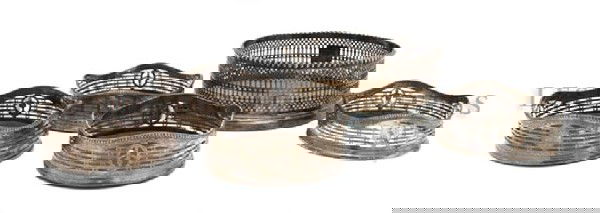 A Set of Four English Silver Wine Coasters, Diameter 4 : A Set of Four English Silver Wine Coasters, marks rubbed, together with another example. Diameter 4 5/8 inches. Property from the Estate of Anne Scholl, Indian Wells, California