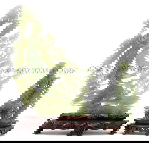 A Group of Two Chinese Hardstone Carvings, Height of ta: A Group of Two Chinese Hardstone Carvings, both of semi-translucent olive green stone, the first depicting a standing beauty holding a basket of flowers, the second of a standing figure holding a sphe