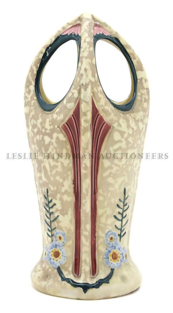 A Royal Dux Art Nouveau Pottery Vase,: of cylindrical form, with four connected handles. Height 11 inches.
