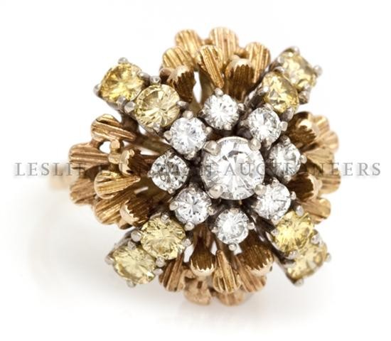 A 14 Karat Yellow Gold, Yellow and White Diamond Cluste: A 14 Karat Yellow Gold, Yellow and White Diamond Cluster Ring, containing eight round brilliant cut yellow diamonds weighing approximately 0.96 carat total and nine round brilliant cut diamonds weighi