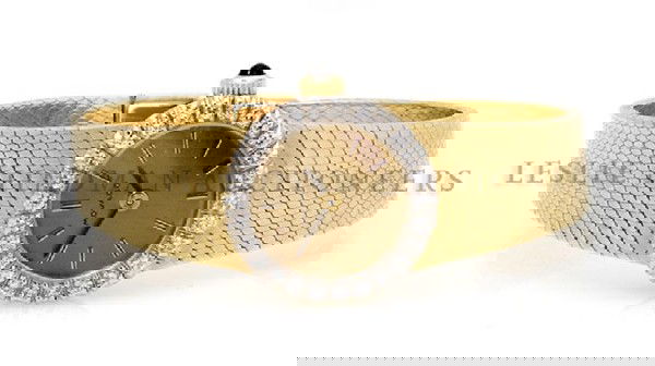 A 14 Karat Yellow Gold Diamond Mechanical Watch, Movado: A 14 Karat Yellow Gold Diamond Mechanical Watch, Movado, containing 26 round brilliant cut diamonds weighing approximately 0.40 carat total, brushed gilt dial, applied gilt baton numerals, matte black