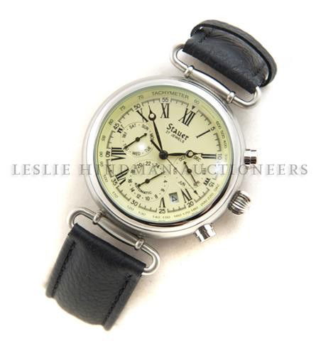 A Stainless Steel Chronograph Wristwatch, Stauer,: A Stainless Steel Chronograph Wristwatch, Stauer, white enamel dial, black Roman numerals, sweep second hand, three subsidiary dials for day, month and date, with chronograph function, black leather s