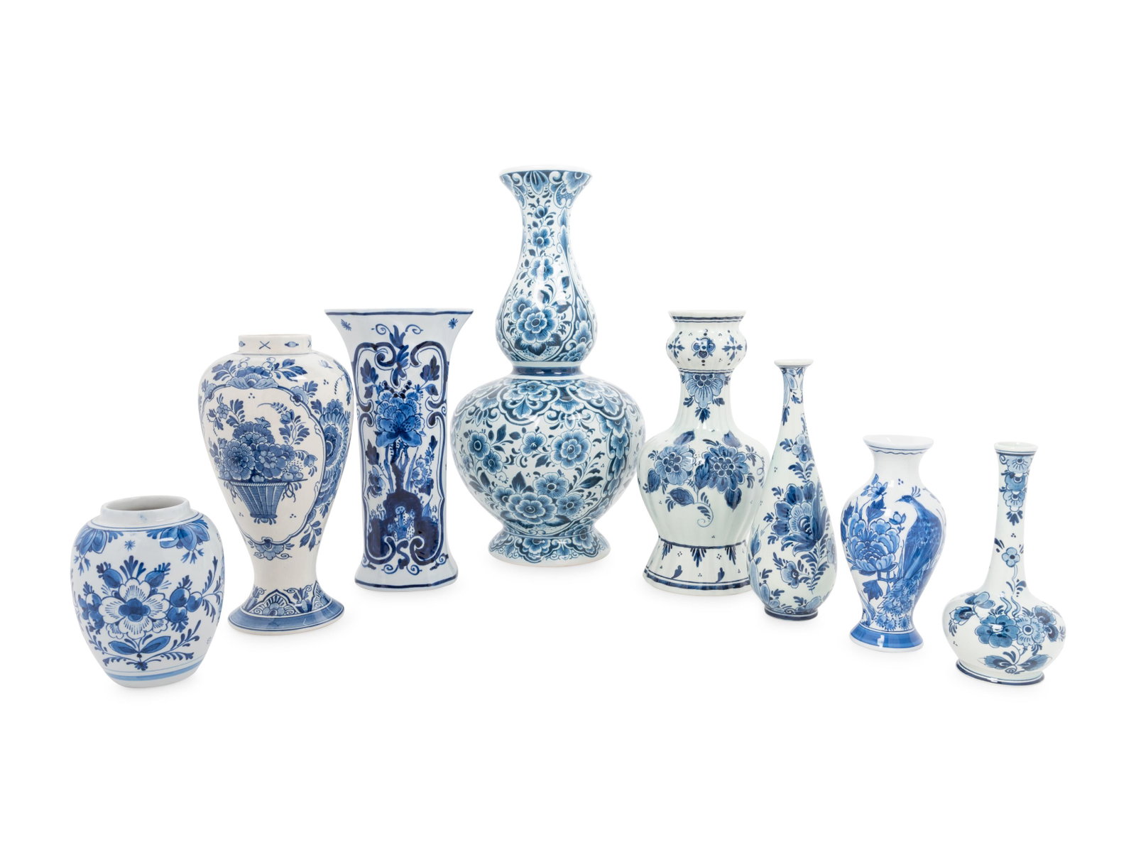 A Group of Eight Blue and White Earthenware Vases,: A Group of Eight Blue and White Earthenware Vases, Primarily Delft 20th Century each stamped to the underside. Height of tallest example 16 inches.