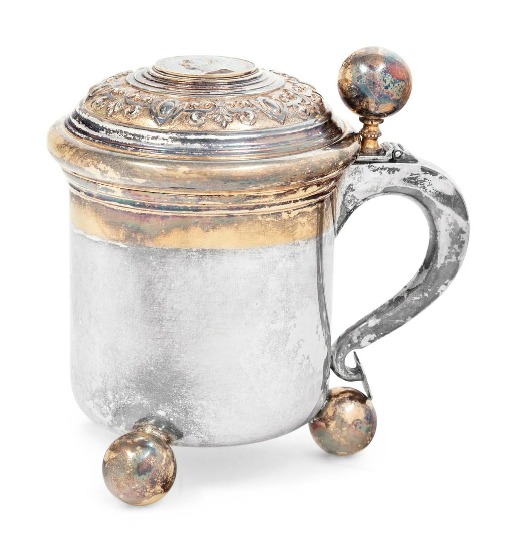 A Swedish Silver Coin-Inset Tankard: A Swedish Silver Coin-Inset Tankard C.G. Hallberg, Stockholm, 1952 marked to the underside 9 ozt 10 dwt Height 5 1/4 inches. 