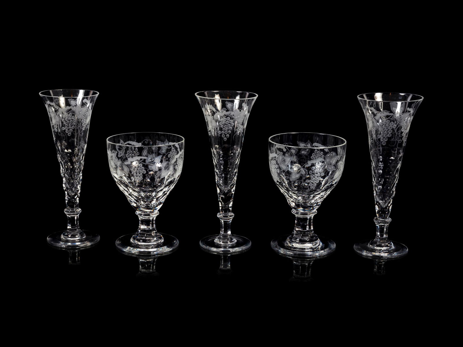 A Collection of William Yeoward Etched Glass Stemware: A Collection of William Yeoward Etched Glass Stemware Articles comprising 12 wine goblets and 11 champagne flutes; 23 items total. Height of flutes 8 1/8 inches; height of goblets 5 7/8 inches.