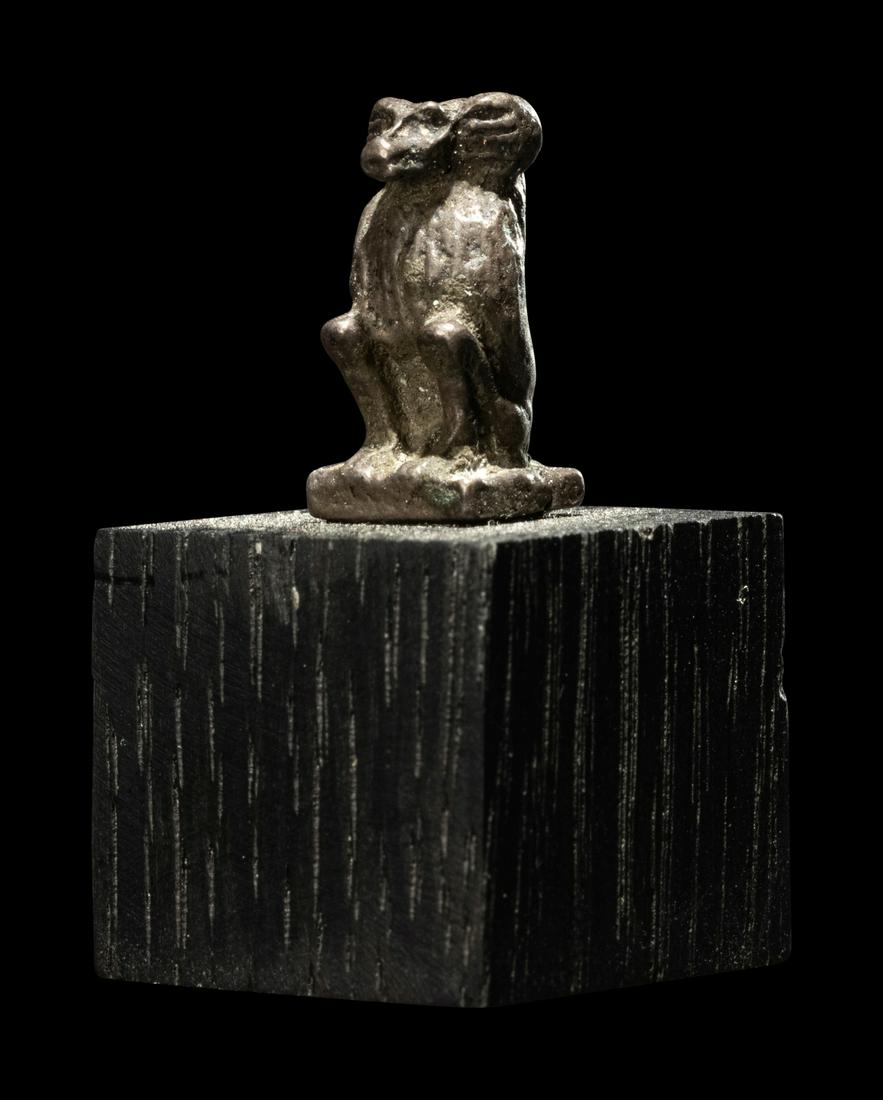 An Egyptian Silver Baboon Height 3/4 inches (2 cm). (1 of 3)