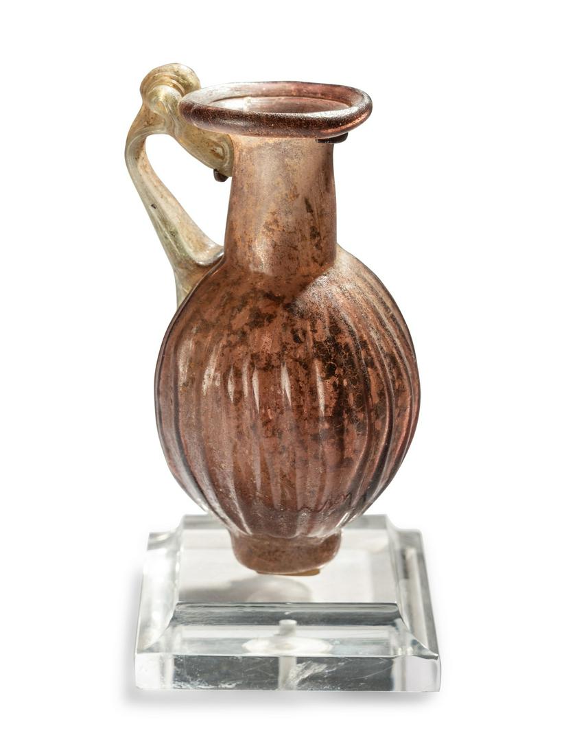 A Roman Purple Glass Jug Height 3 inches (8 cm). (1 of 3)