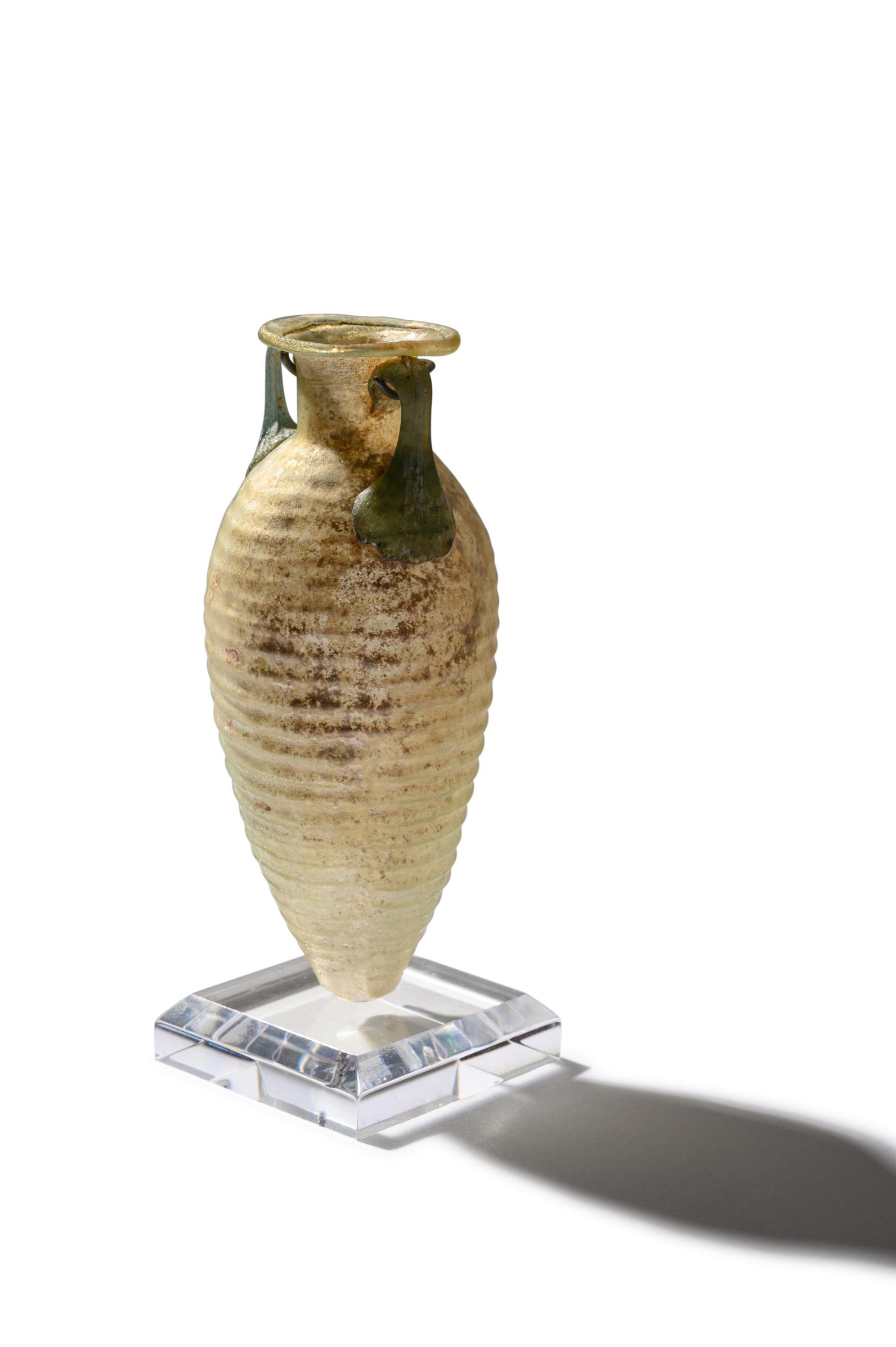 A Roman Glass Amphoriskos Height 4 1/2 inches (11 cm). (1 of 5)