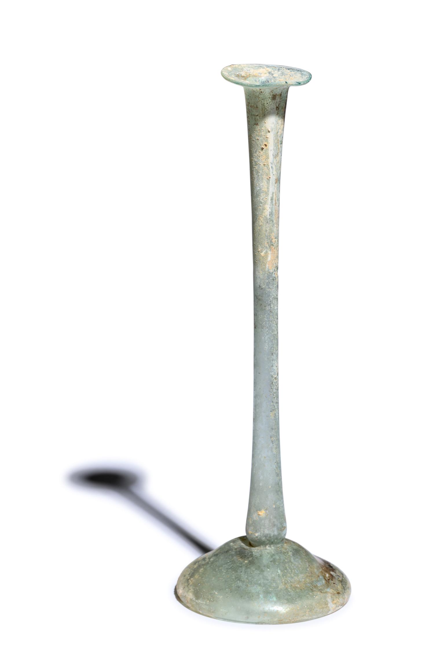 A Roman Glass Unguentarium Height 8 inches (20.5 cm).: A Roman Glass Unguentarium Circa 2nd-3rd Century A.D. Height 8 inches (20.5 cm). Provenance: Artemis Gallery, Louisville, Colorado, 21 February 2005. (with invoice copy)