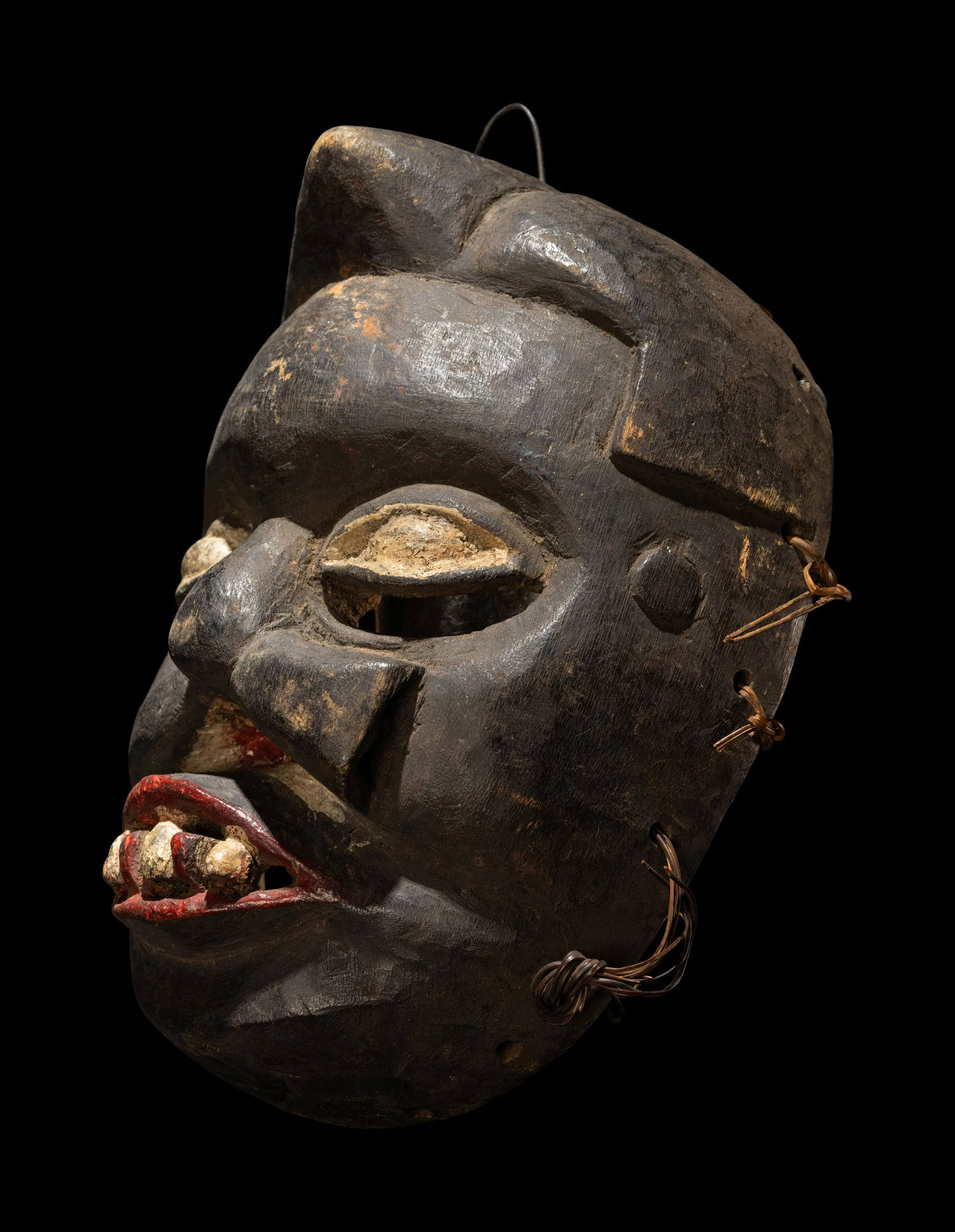 An Ibibio Wood Dance Mask Height 12 inches (30 cm). (1 of 4)