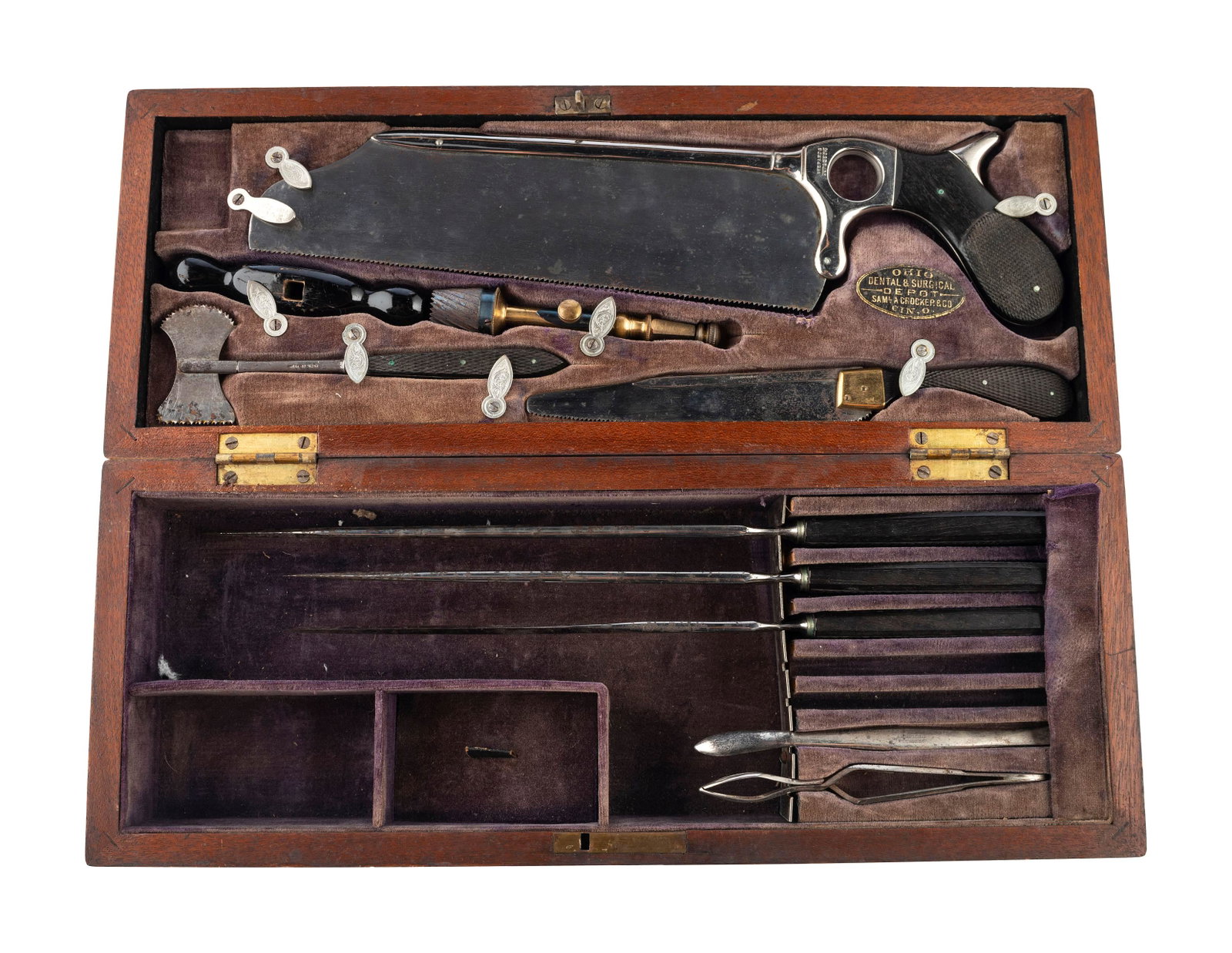 [MEDICAL KIT] Late 19th century amputation and: [MEDICAL KIT] Late 19th century amputation and trephination kit. Cincinnati, OH: Samuel A. Crocker, ca late 1890s. Velvet-lined wood case (6 x 15.5 x 3 in.), top corners with brass, brass cartouche (u