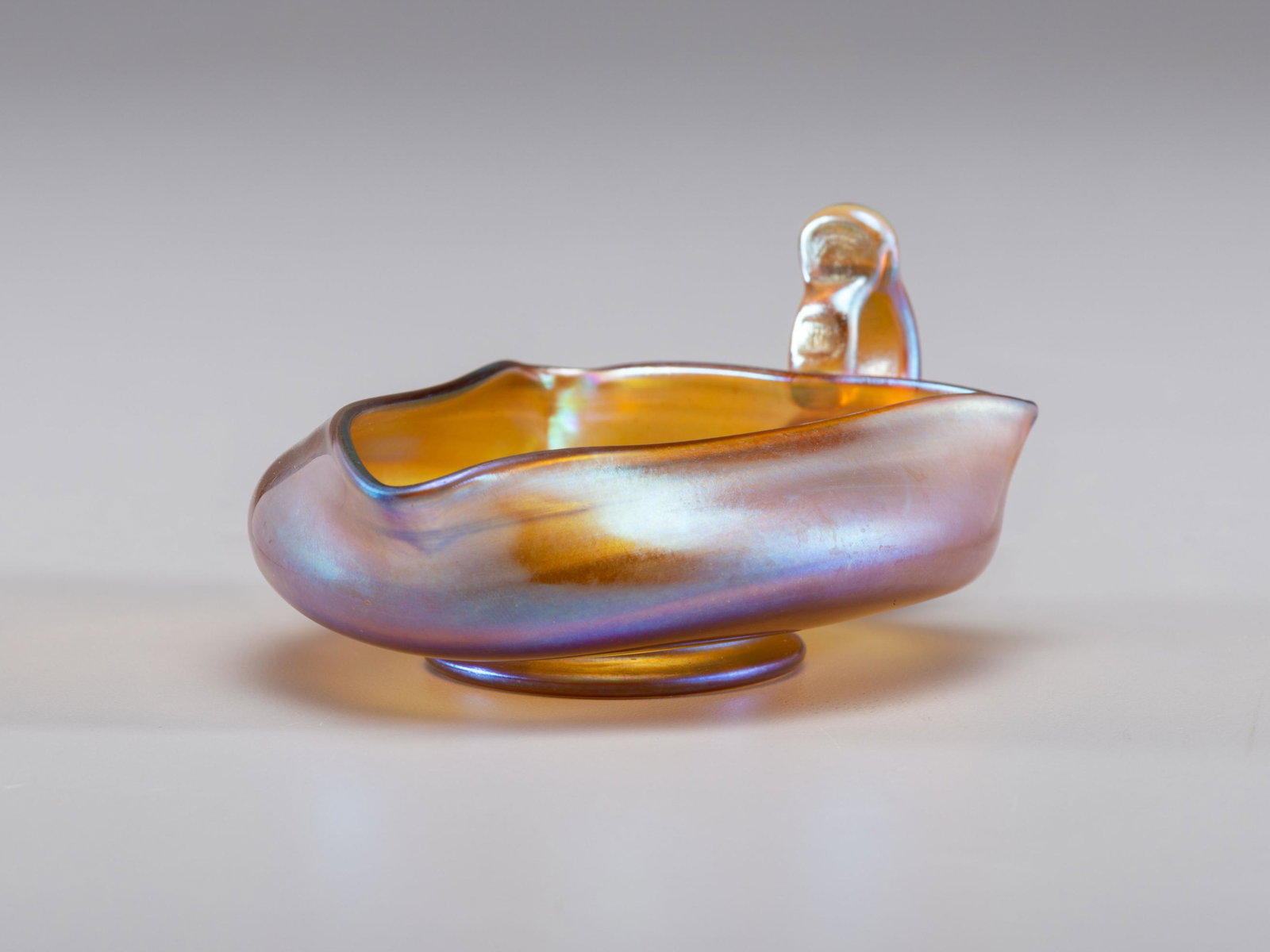 Tiffany Studios American, Early 20th Century Creamer: Tiffany Studios American, Early 20th Century Creamer favrile glass marked 'L.C.T. Favrile' to underside. H 2 1/4 x W 3 3/4 x D 5 inches.