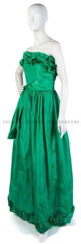 A Bill Blass Strapless Green Evening Gown,: A Bill Blass Strapless Green Evening Gown, with a ruffle neckline, sash belt at waist, very full skirt. Labeled: Bill Blass. Property of a Lady New York City, New York