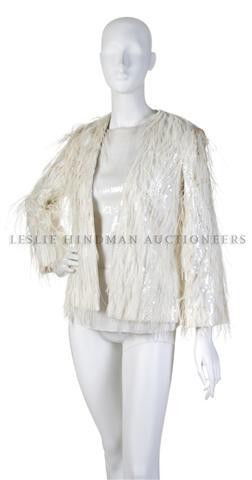 A Bill Blass Sequin Top with a Matching Feather and: A Bill Blass Sequin Top with a Matching Feather and Sequin Jacket. Labeled: Bill Blass. Property of a Lady New York City, New York