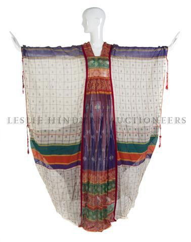 A Thea Porter Silk and Cotton Patchwork Ikat Cafta: A Thea Porter Silk and Cotton Patchwork Ikat Caftan, with pink velvet trim at front. Labeled: Thea Porter Couture. Property of a Lady New York City, New York