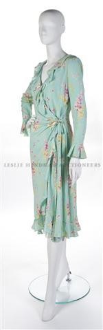 An Ungaro Pale Blue Floral Summer Dress, Size 10.: An Ungaro Pale Blue Floral Summer Dress, in a wrap style tying at waist. Labeled: Emanuel Ungaro. Size 10. Property of a Lady New York City, New York