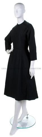 A Christian Dior Black Wool Dress,: A Christian Dior Black Wool Dress, probably 1950s, with a fitted bodice, full skirt. Labeled: Christian Dior London/4332.