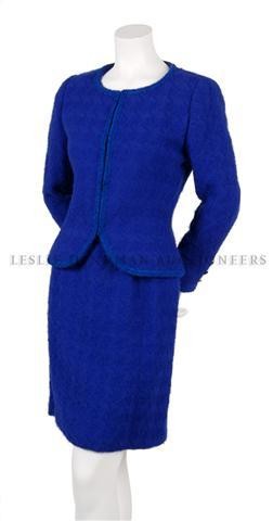 A Chanel Couture Cobalt Blue Wool Suit,: A Chanel Couture Cobalt Blue Wool Suit, probably 1960s, in bouclé tweed, jacket with braided trim, straight skirt, fully lined. Labeled: Chanel (numbered label removed).