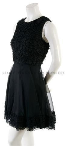 A Jean Varon Black Lace and Chiffon Dress,: A Jean Varon Black Lace and Chiffon Dress, probably 1960s, with a ruffled lace bodice, very flared skirt with a lace hemline, fully lined. Labeled: Jean Varon.