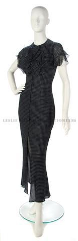 A Givenchy Blue Chiffon Polka Dot Dress,: A Givenchy Blue Chiffon Polka Dot Dress, full length with a ruffled neckline. Labeled: Givenchy Couture.