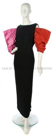 A Bill Blass Black Evening Gown,: A Bill Blass Black Evening Gown, 1980s, with pink and red exaggerated sleeves. Labeled: Bill Blass.