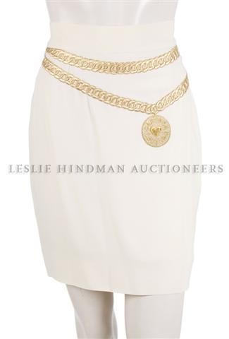 A Group of Clothing,: A Group of Clothing, comprised of a Moschino skirt and blouse, a pair of Gaultier pants, two Missoni skirts and a blouse. Together with another skirt, probably Moschino.